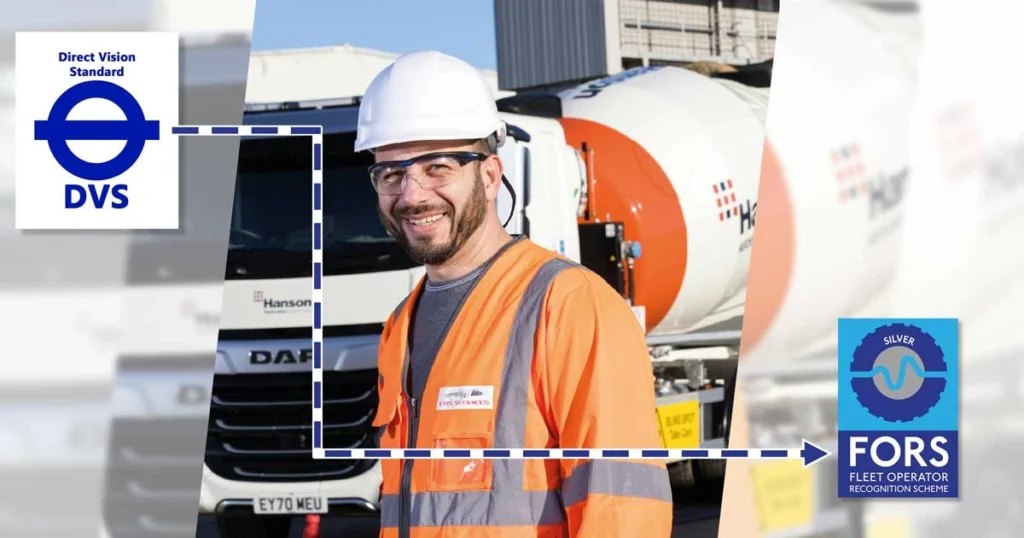 HGV Driver smiling in front of his dvs compliant cement mixer lorry
