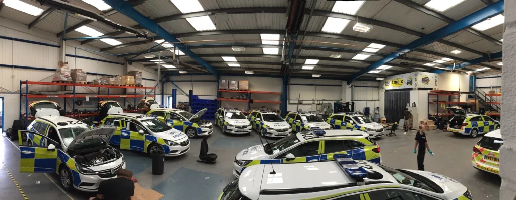 Police fleet in workshop